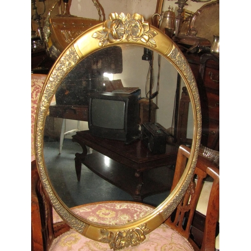 491 - Two Antique Oval Form Gilt Framed Wall Mirrors with Upper Floral Motif Decoration Approximately 26 I... 