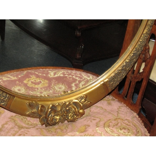 491 - Two Antique Oval Form Gilt Framed Wall Mirrors with Upper Floral Motif Decoration Approximately 26 I... 