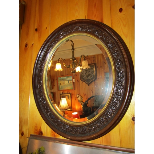 545 - Antique Oval Form Wall Mirrors with Gilt Inset Slips Each Approximately 24 Inches High