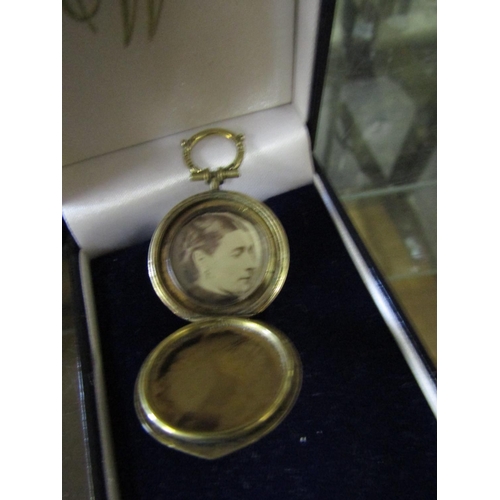 552 - 9 Carat Gold Locket with Hinged Cover