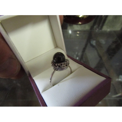 554 - 18 Carat White Gold Mounted Tahitian Black Pearl Mounted Ladies Ring with Cluster Diamond Surround