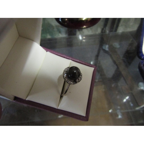 554 - 18 Carat White Gold Mounted Tahitian Black Pearl Mounted Ladies Ring with Cluster Diamond Surround