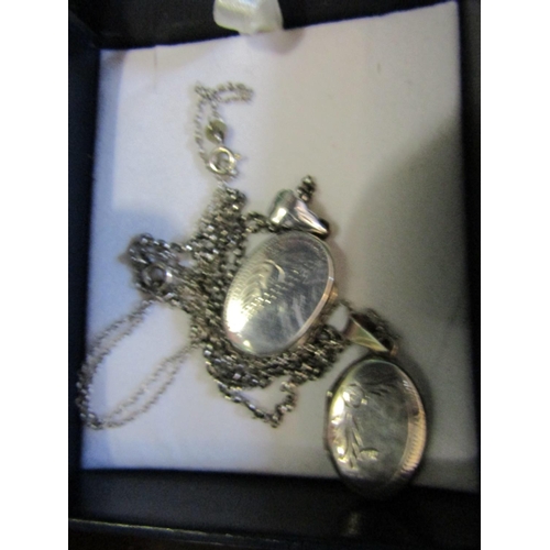 693 - Two Solid Silver Lockets on Solid Silver Chains Antique