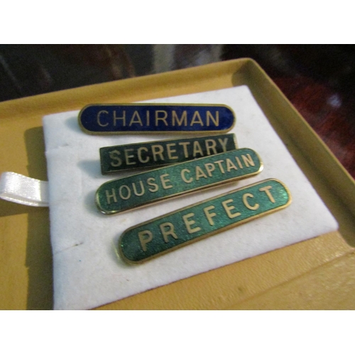 703 - Set of Four Enamel Gilt Decorated Jacket Labels Chairman, Secretary, House Captain, Prefect containe... 