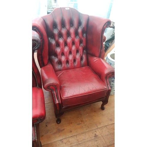 253 - Pair of Burgundy Leather Deep Button Upholstered Wingback Armchairs of Generous Form Good Condition