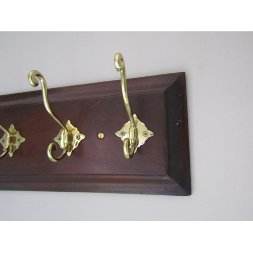 141 - Four Brass Hook Mahogany Panel Mounted Coat and Hat Hanger Approximately 20 Inches Wide