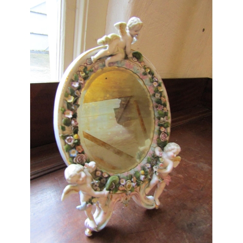 267 - Victorian Porcelain Table Mirror Oval Form with Cupid Decoration Approximately 11 Inches High