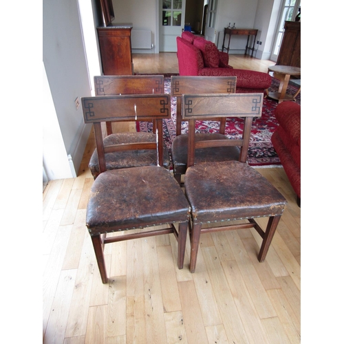 89 - Set of Four Irish Regency Leather Upholstered Chairs with Grecian Motif Ebony Inlaid Back Supports