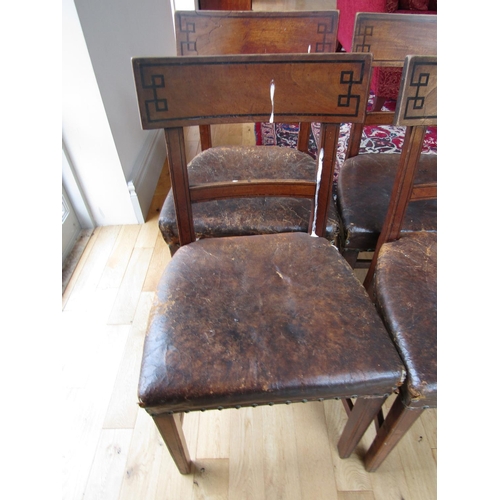 89 - Set of Four Irish Regency Leather Upholstered Chairs with Grecian Motif Ebony Inlaid Back Supports