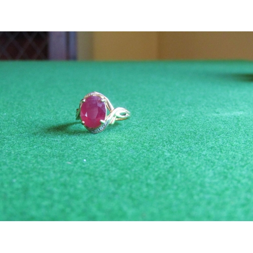 521 - Ruby and Diamond Twist Motif Ladies Ring Mounted on 9 Carat Yellow Gold Ring Size N and a Half