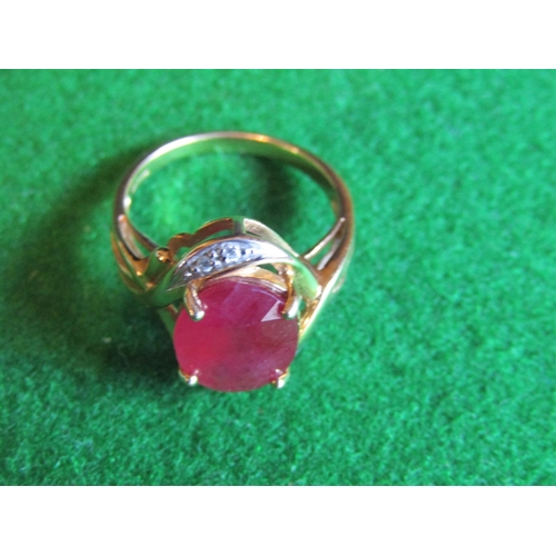 521 - Ruby and Diamond Twist Motif Ladies Ring Mounted on 9 Carat Yellow Gold Ring Size N and a Half