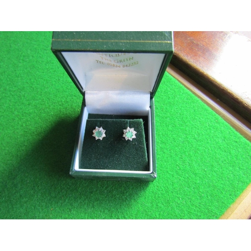 533 - Pair of Platinum Set Emerald and Diamond Cluster Earrings Central Oval Cut Emerald Surrounded by Eig... 