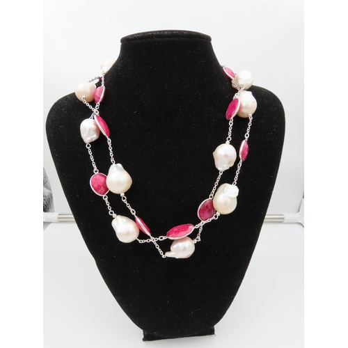 100 - Ruby and Cultured Pearl Ladies Necklace of Attractive Form Length Approximately 96cm