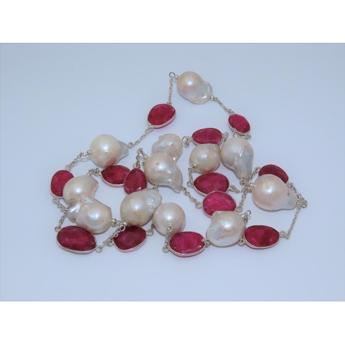 100 - Ruby and Cultured Pearl Ladies Necklace of Attractive Form Length Approximately 96cm