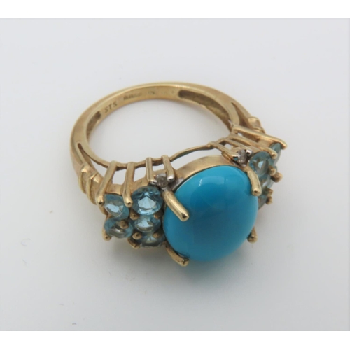 101 - Turquoise Set Cabochon Cut Centre Stone Ring with Side Topaz Decoration Mounted on 9 Carat Yellow Go... 