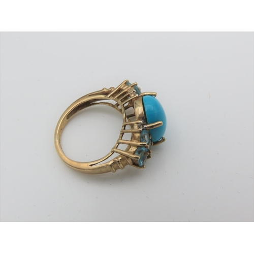 101 - Turquoise Set Cabochon Cut Centre Stone Ring with Side Topaz Decoration Mounted on 9 Carat Yellow Go... 