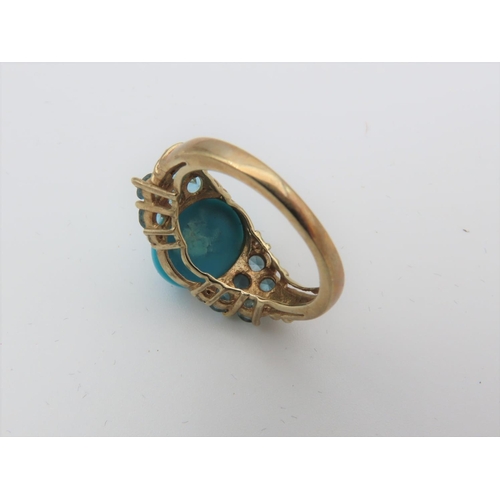 101 - Turquoise Set Cabochon Cut Centre Stone Ring with Side Topaz Decoration Mounted on 9 Carat Yellow Go... 