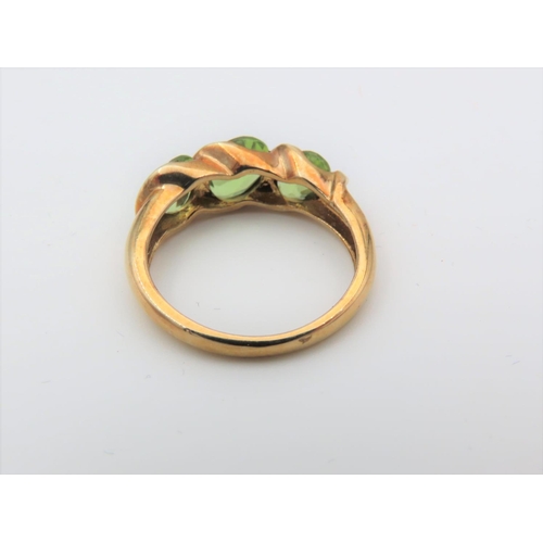 103 - Peridot Three Stone Ladies Ring Mounted on 9 Carat Gold Ring Size J