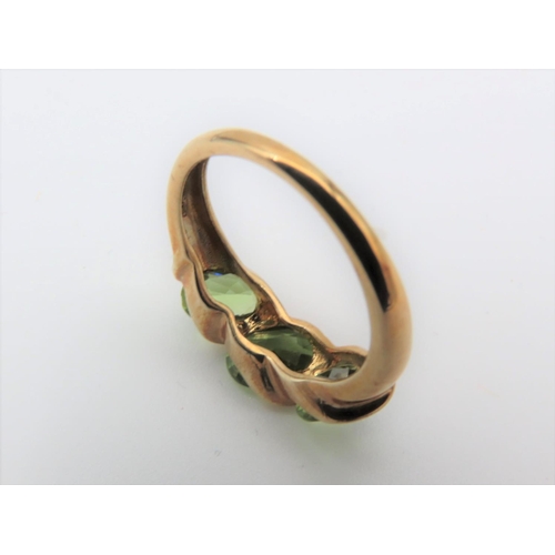 103 - Peridot Three Stone Ladies Ring Mounted on 9 Carat Gold Ring Size J