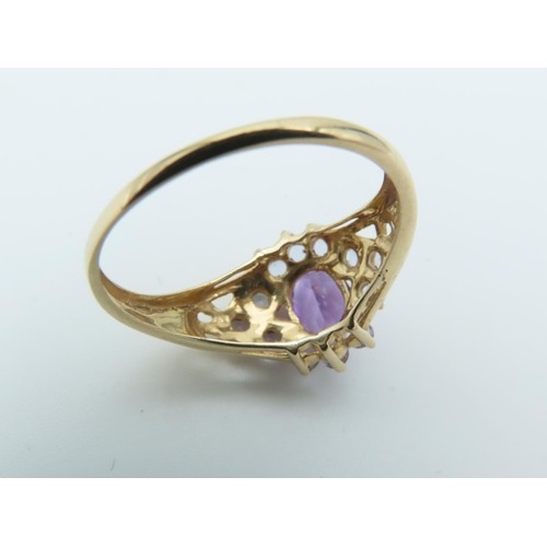 112 - Amethyst and Tanzanite Set Ladies Ring Hallmarks 2005 Mounted on 9 Carat Yellow Gold Band Ring Size ... 