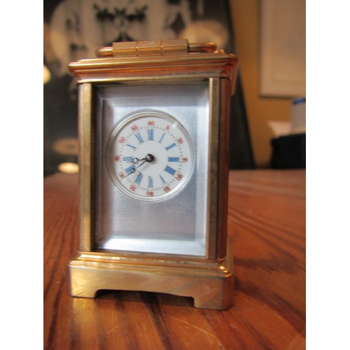 1140 - Brassbound Carriage Clock with Roman Numeral Decorated Dial Approximately 4 Inches High