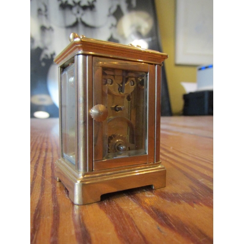 1140 - Brassbound Carriage Clock with Roman Numeral Decorated Dial Approximately 4 Inches High