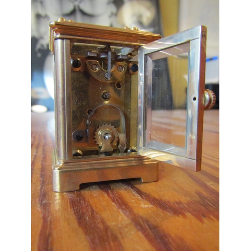 1140 - Brassbound Carriage Clock with Roman Numeral Decorated Dial Approximately 4 Inches High