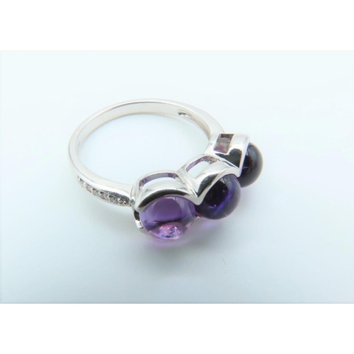 125 - 9 Carat White Gold Set Amethyst Ladies Three Stone Ring with Further Diamond Decorated Shoulders