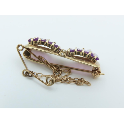 133 - Amethyst and Diamond Set Assent Bow Motif Brooch 9 Carat Gold Approximately 2.6cm Wide