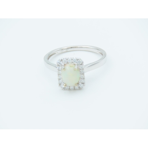 149 - Opal and Diamond Set Ladies Cluster Ring Mounted on 18 Carat Gold Ring Size M