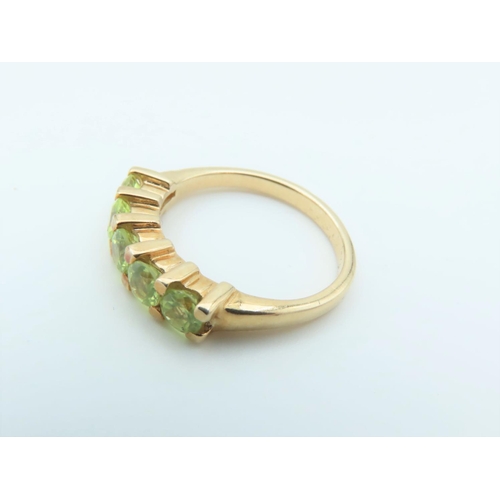 159 - 9 Carat Yellow Gold Mounted Peridot Five Stone Ring Size N