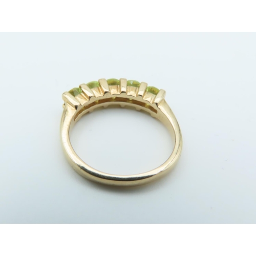 159 - 9 Carat Yellow Gold Mounted Peridot Five Stone Ring Size N