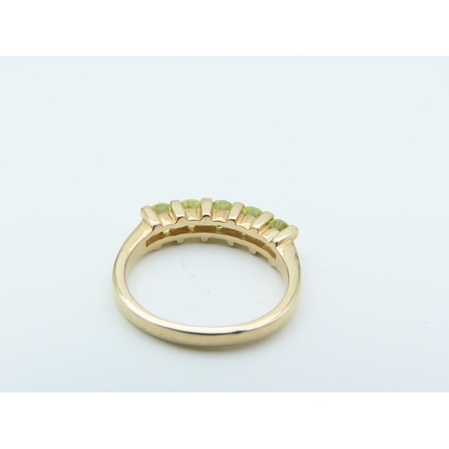 159 - 9 Carat Yellow Gold Mounted Peridot Five Stone Ring Size N