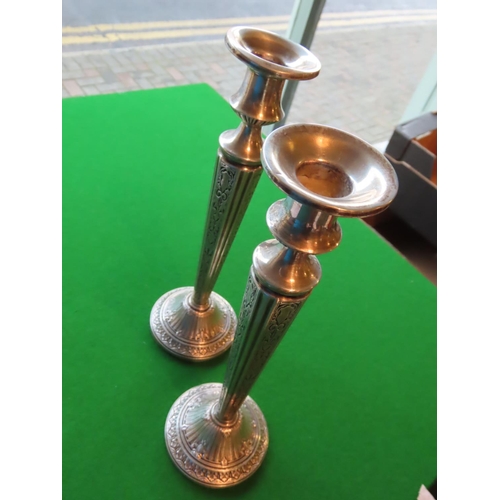 173 - Pair of Tall Embossed Solid Silver Candle Sticks of Turned Form Each Approximately 10 Inches High