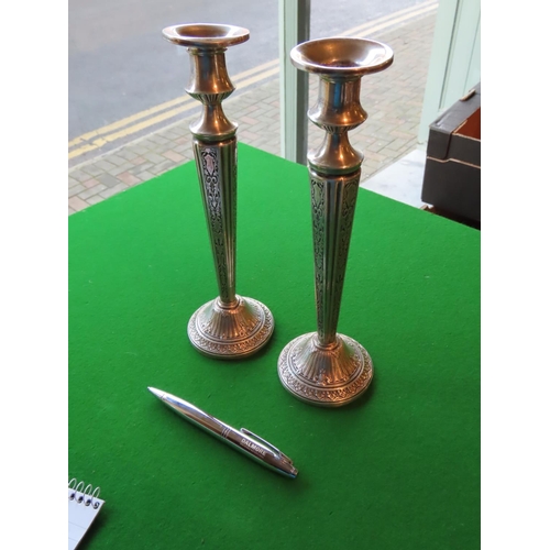 173 - Pair of Tall Embossed Solid Silver Candle Sticks of Turned Form Each Approximately 10 Inches High