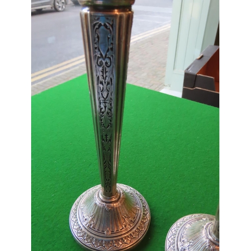 173 - Pair of Tall Embossed Solid Silver Candle Sticks of Turned Form Each Approximately 10 Inches High