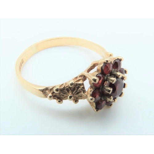 300 - 9 Carat Gold Garnet Cluster Ring Size N and a Half with Decorated Shoulders