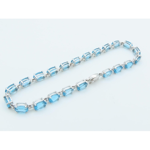 312 - Blue Topaz 9 Carat White Gold Mounted Ladies Line Bracelet Length Approximately 18cm