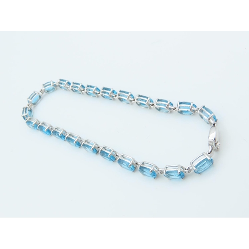 312 - Blue Topaz 9 Carat White Gold Mounted Ladies Line Bracelet Length Approximately 18cm