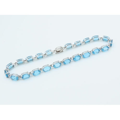 312 - Blue Topaz 9 Carat White Gold Mounted Ladies Line Bracelet Length Approximately 18cm