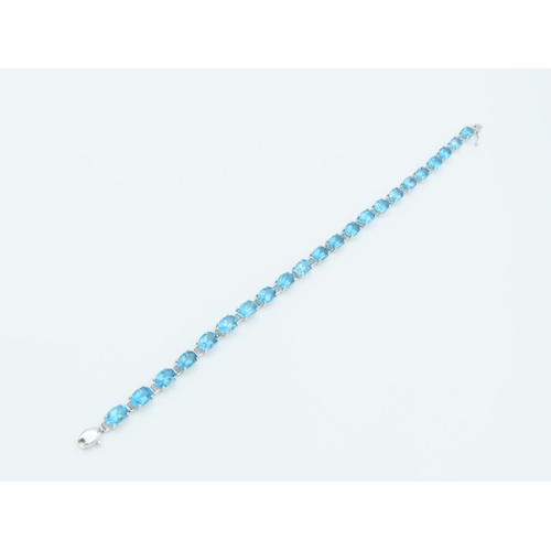 312 - Blue Topaz 9 Carat White Gold Mounted Ladies Line Bracelet Length Approximately 18cm