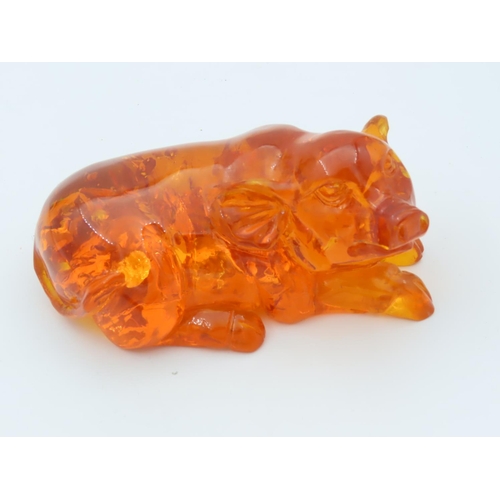 480 - Amber Figure of Seated Pig Approximately 3 Inches Wide