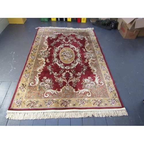 511 - Burgundy Ground Persian Rug with Patterned Borders Central Medallion Motif Approximately 8ft Long x ... 