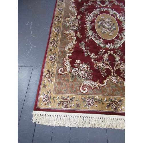 511 - Burgundy Ground Persian Rug with Patterned Borders Central Medallion Motif Approximately 8ft Long x ... 