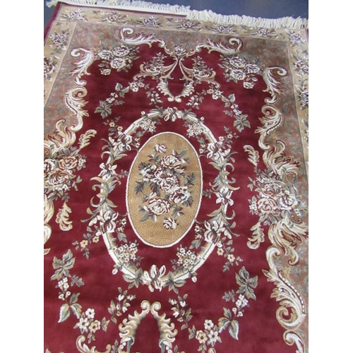 511 - Burgundy Ground Persian Rug with Patterned Borders Central Medallion Motif Approximately 8ft Long x ... 