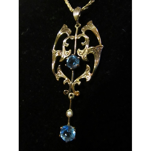 595 - 9 Carat Gold Mounted Pendant Pearl and Topaz Set Hung on 9 Carat Gold Chain