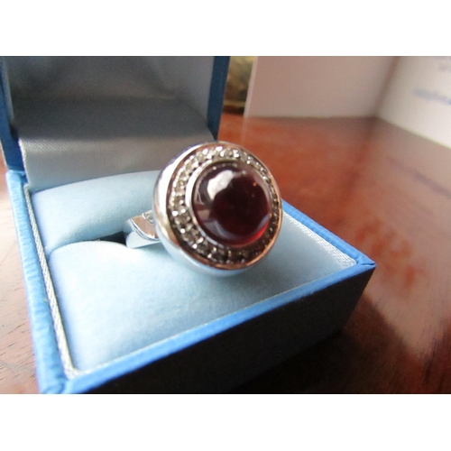 629 - Rubellite Cabochon Cut Centre Stone Ring Diamond Surround Mounted on 18 Carat White Gold Ring Size O