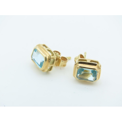 717 - Pair of 18 Carat Yellow Gold Mounted Blue Topaz Set Ear Studs Each with Emerald Blue Topaz Raised Co... 