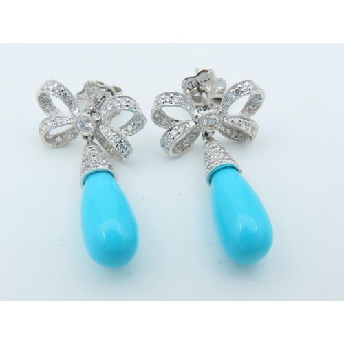 720 - Pair of Diamond and Turquoise Bow Motif Drop Earrings Each Post Headed by a Milligrane Collet Set Ro... 