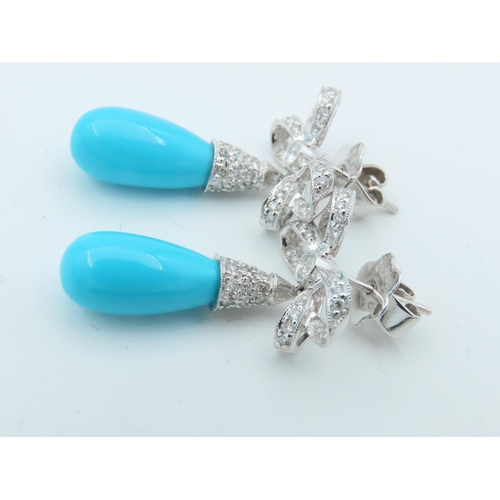 720 - Pair of Diamond and Turquoise Bow Motif Drop Earrings Each Post Headed by a Milligrane Collet Set Ro... 